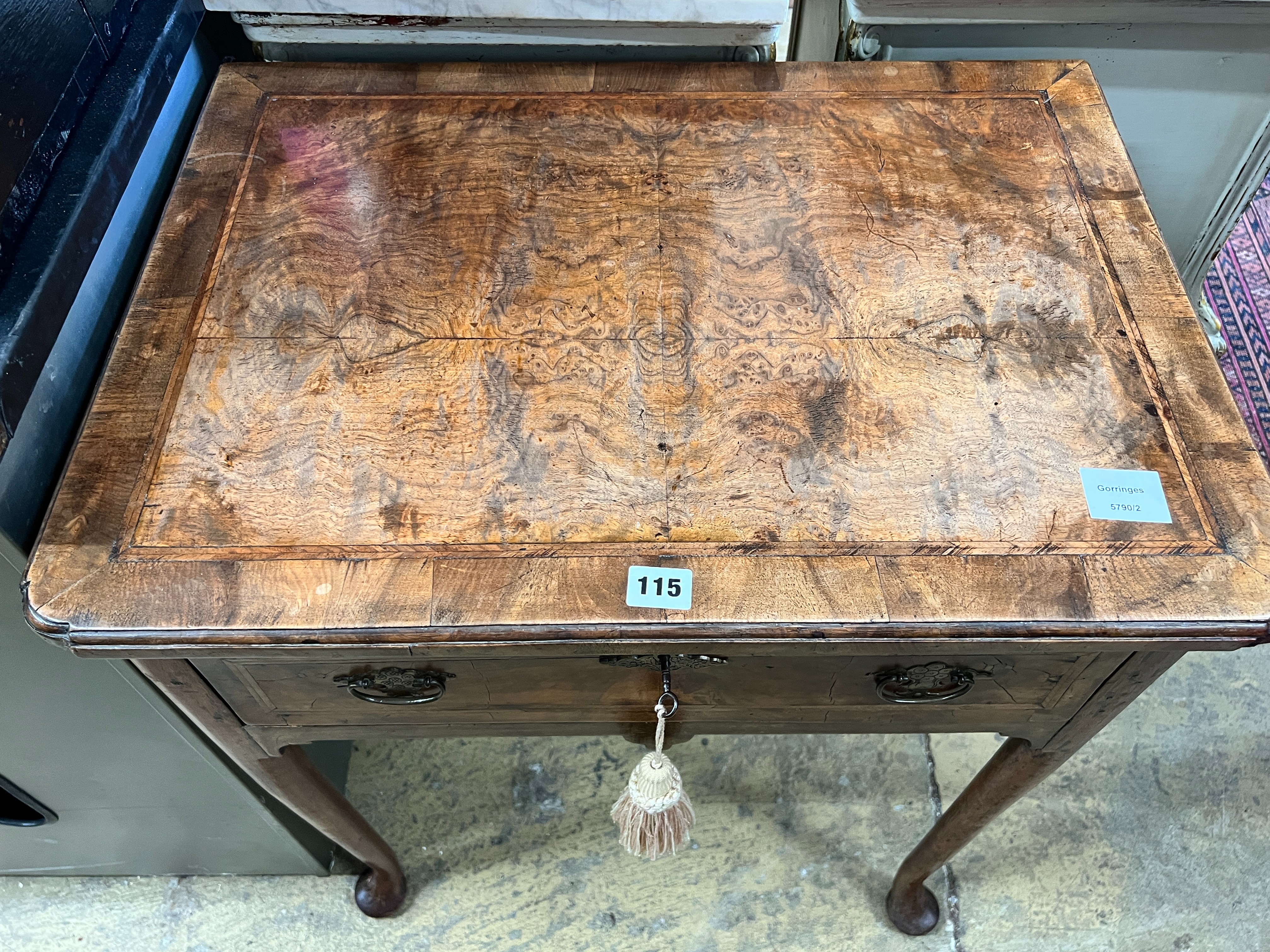 A small 18th century feather banded figured walnut veneered lowboy, width 64cm, depth 46cm, height 71cm